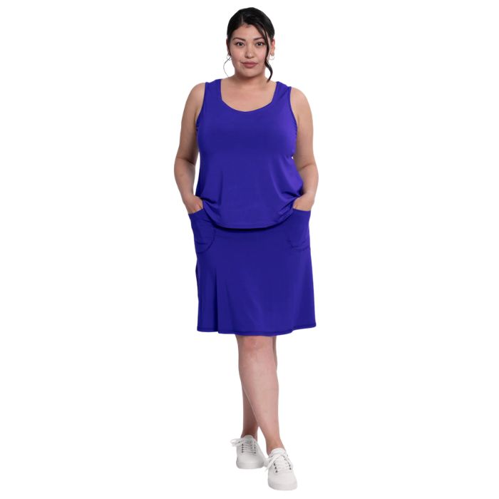 female model wearing violet purple  ritzy tank top and violet purple magna skort front view on white background