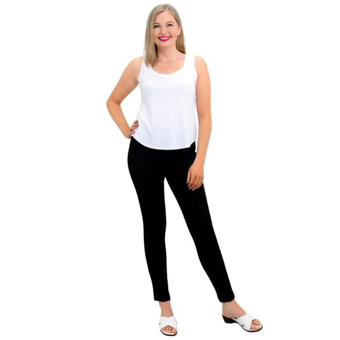 female model wearing white ritzy tank top and black nadia pants front view on white background