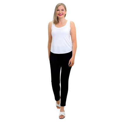 female model wearing white ritzy tank top and black nadia pants front view on white background