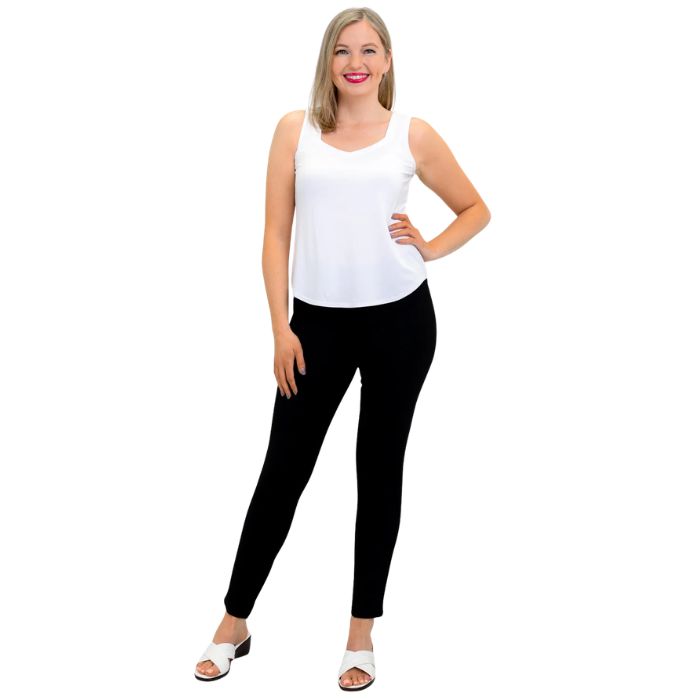 female model wearing white ritzy tank top and black nadia pants front view on white background