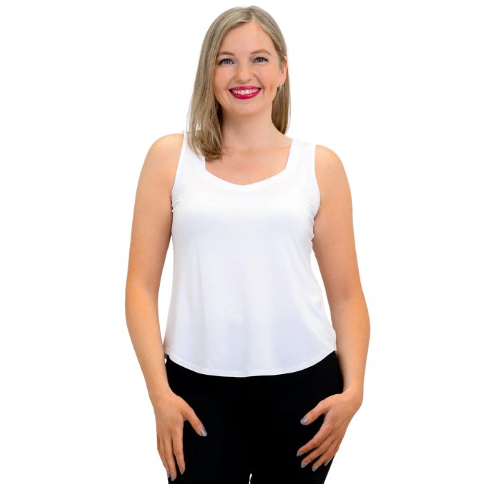 female model wearing white ritzy tank top front view on white background