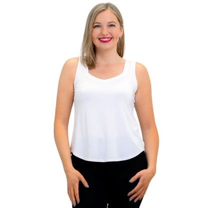 female model wearing white ritzy tank top front view on white background