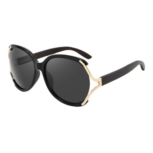 rosewood sunglasses black and gold frames and black lenses over view on white background