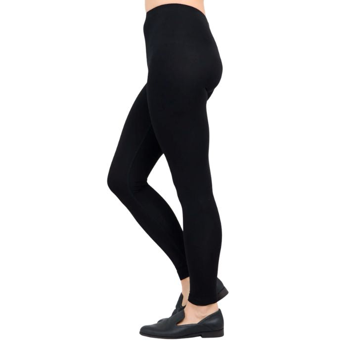 female model wearing black ruby leggings side view on white background