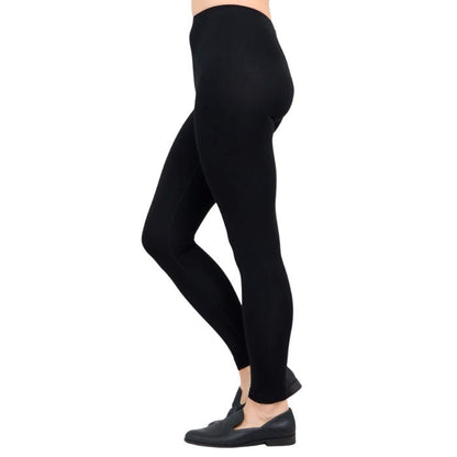female model wearing black ruby leggings side view on white background