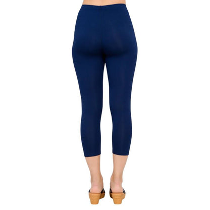 female model wearing indigo blue ruby capri leggings back view on white background