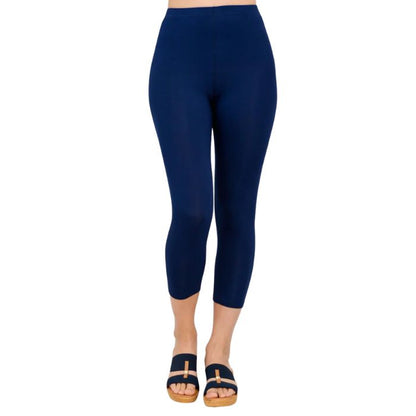 female model wearing indigo blue ruby capri leggings front view on white background