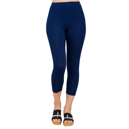 female model wearing indigo blue ruby capri leggings front view on white background