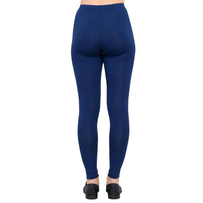female model wearing indigo blue ruby leggings back view on white background