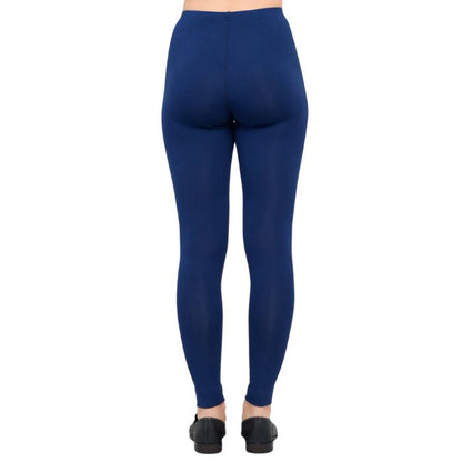 female model wearing indigo blue ruby leggings back view on white background