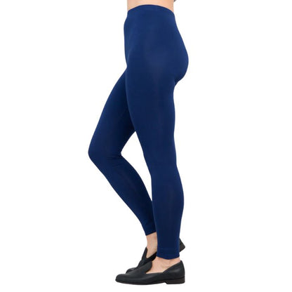 female model wearing indigo blue ruby leggings side view on white background