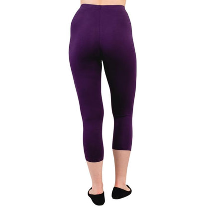 female model wearing royale purple ruby capri leggings back view on white background