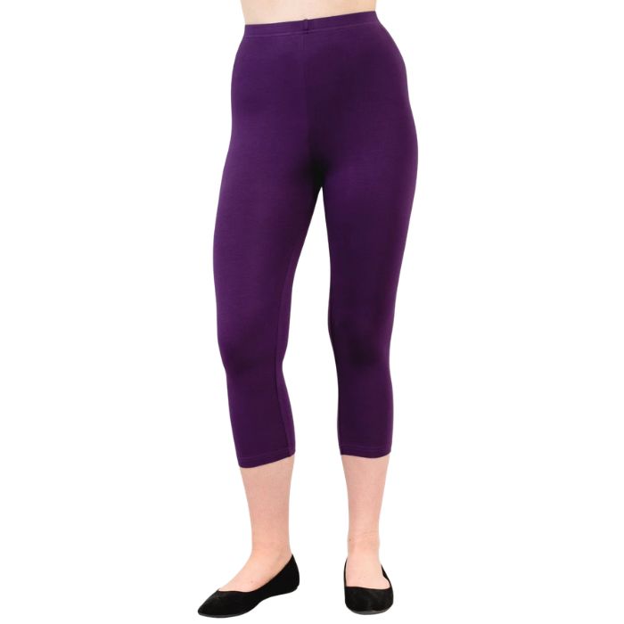 female model wearing royale purple ruby capri leggings front view on white background