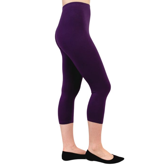 female model wearing royale purple ruby capri leggings side view on white background
