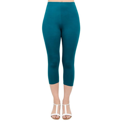 female model wearing teal green ruby capri leggings front view on white background