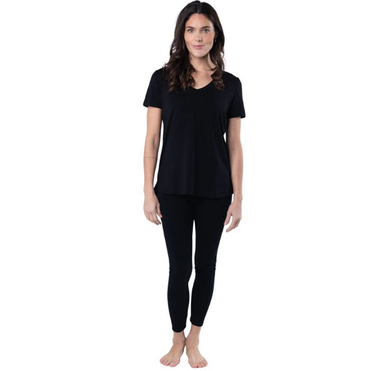 female model wearing black rylie v-neck tee and black terry leggings front view on white background