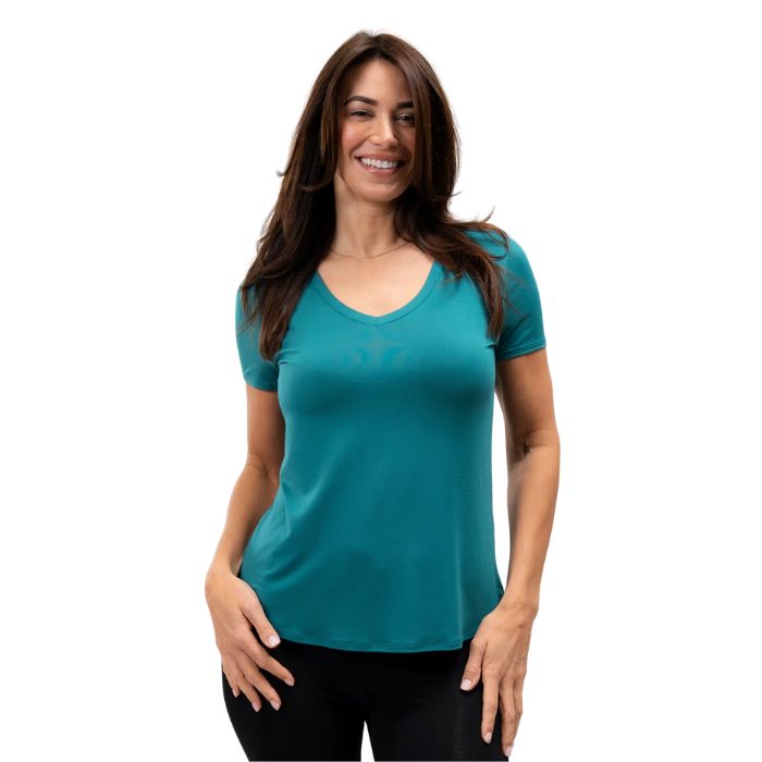 female model wearing coastal teal green rylie v-neck tee front view on white bacground