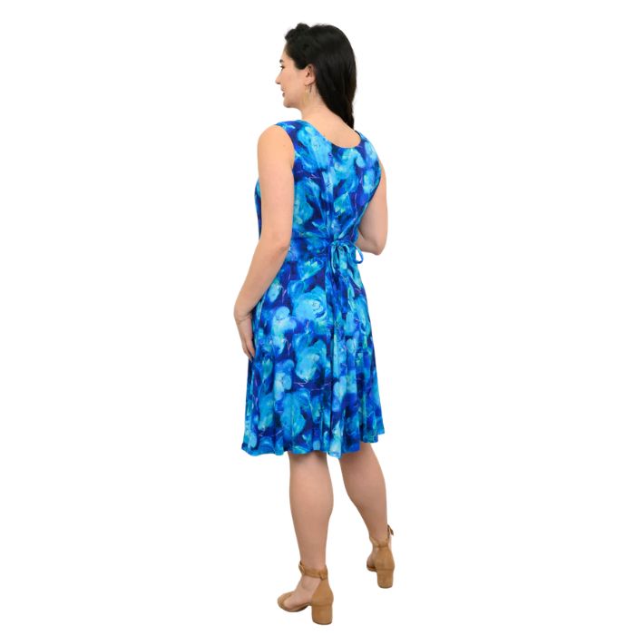 female model wearing ocean reef print sara dress back view on white background