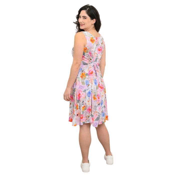 female model wearing pink bouquet print sara dress back view on white background