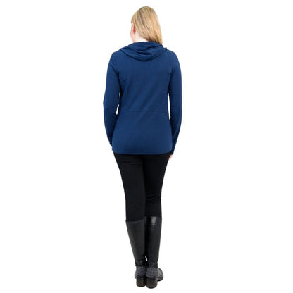 a woman wearing indigo blue seymour jacket and black dixie leggings back view set on a studio white background