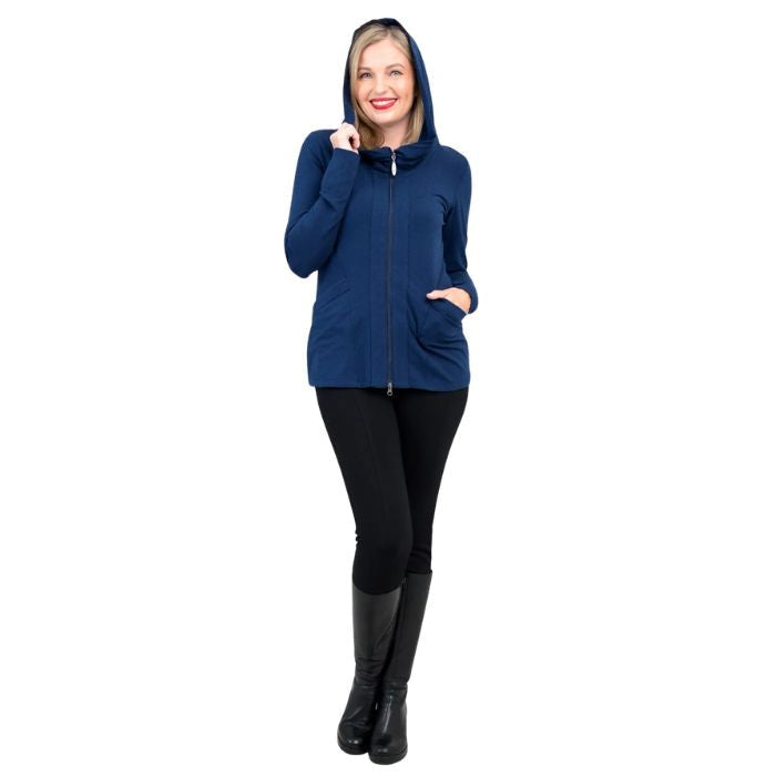 a woman wearing indigo blue seymour jacket and black dixie leggings front view set on a studio white background