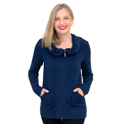 a woman wearing indigo blue seymour jacket waist up front view set on a studio white background