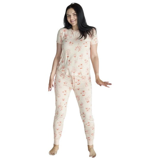 female model wearing sophie plantastic print short sleeve tee and banded ankle pant two piece pajama set front view on white background