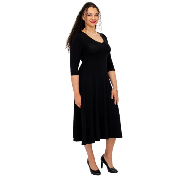female model wearing black soul dress side view on white background