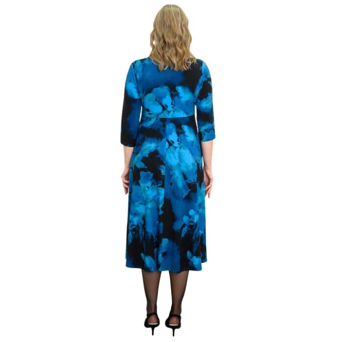 woman wearing blue space print soul dress back view set on a white background