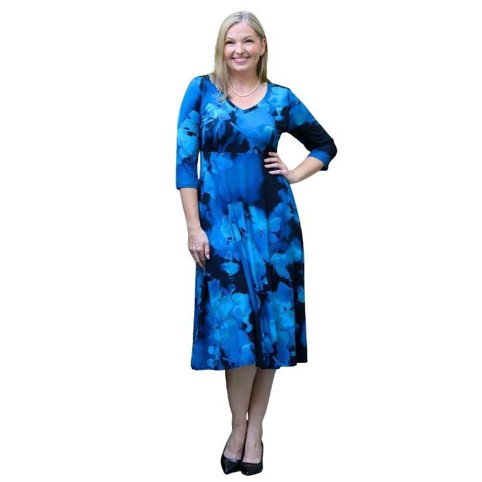 woman wearing blue space print soul dress front view set on a white background