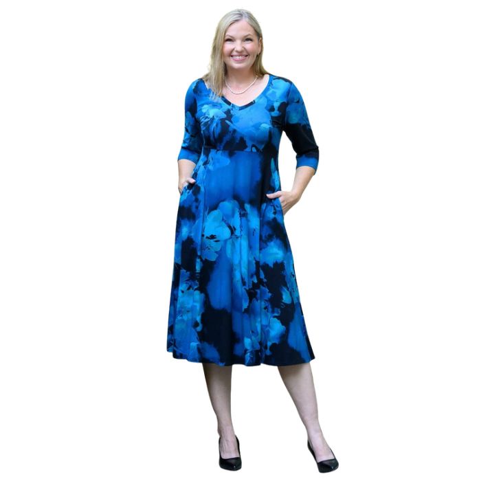 woman wearing blue space print soul dress front view set on a white background