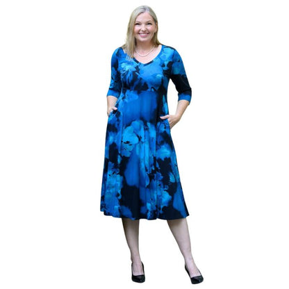 woman wearing blue space print soul dress front view set on a white background