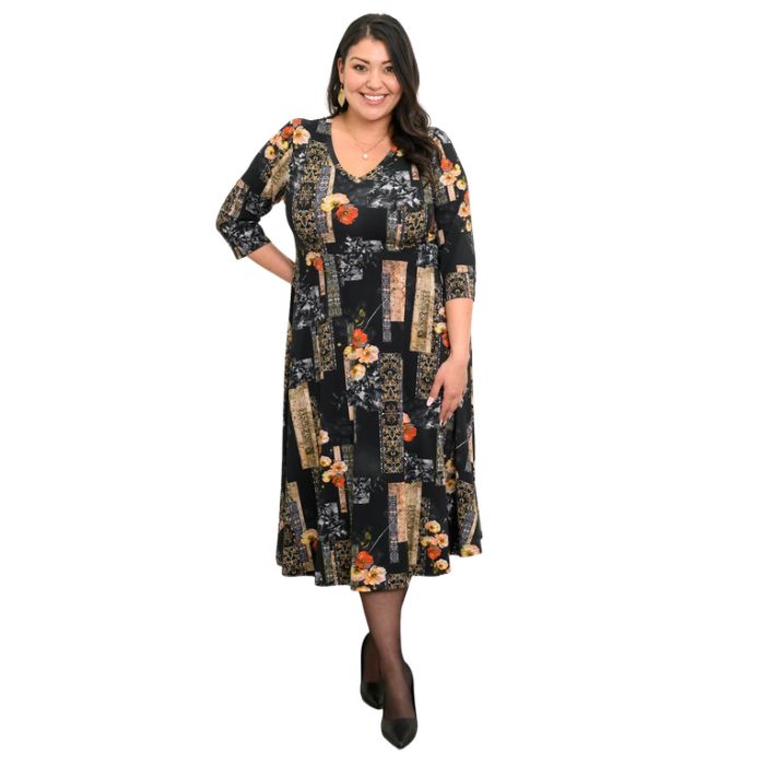 woman wearing golden garden print soul dress front view set on a white background
