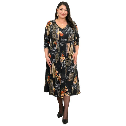 woman wearing golden garden print soul dress front view set on a white background
