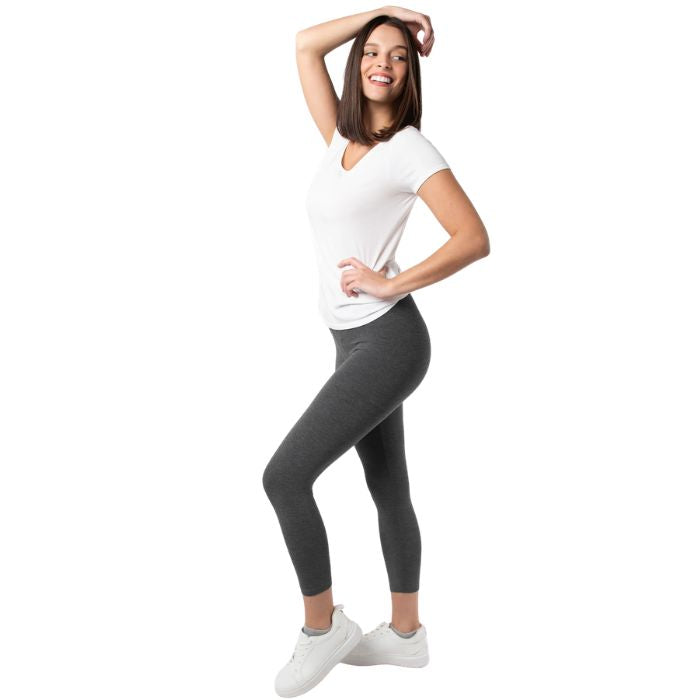 female model wearing charcoal grey suri capri length leggings and white  brenda tee side view on white background 