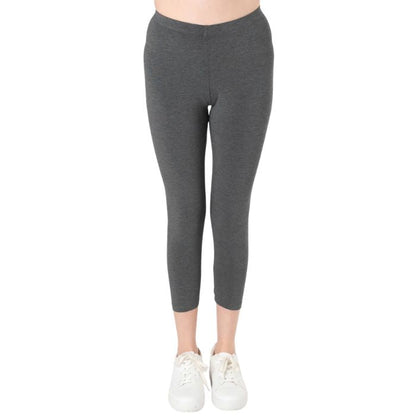 female model wearing charcoal grey suri capri length leggings front view on white background 