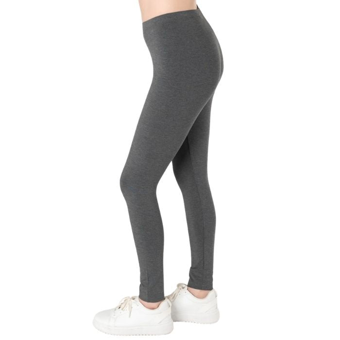 female model wearing charcoal grey suri full length leggings side view on white background 
