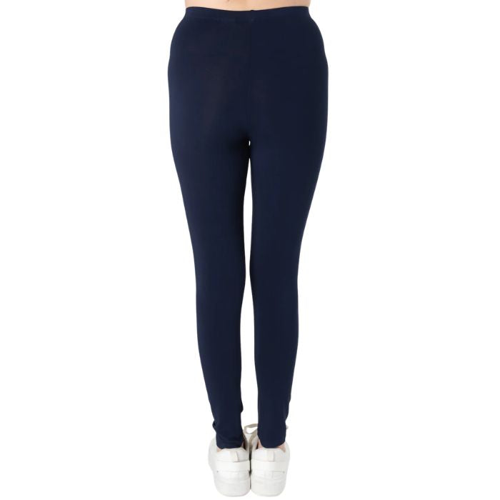 female model wearing ink blue suri full length leggings back view on white background 