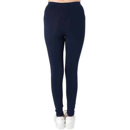 female model wearing ink blue suri full length leggings back view on white background 