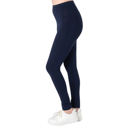 female model wearing ink blue suri full length leggings side view on white background 