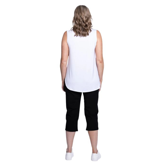 female model wearing black susan capri pants and white jazz tank top back view on white background