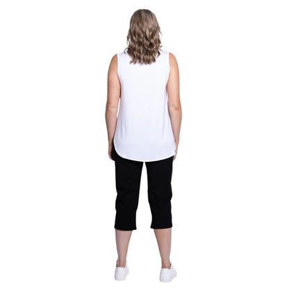 female model wearing black susan capri pants and white jazz tank top back view on white background