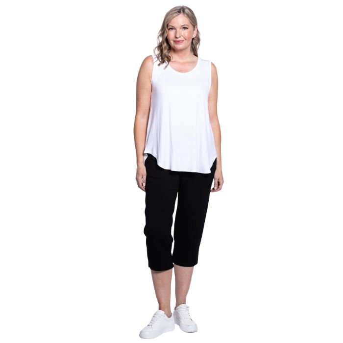 female model wearing black susan capri pants and white jazz tank top front view on white background