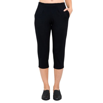 female model wearing black susan capri pants front view on white background