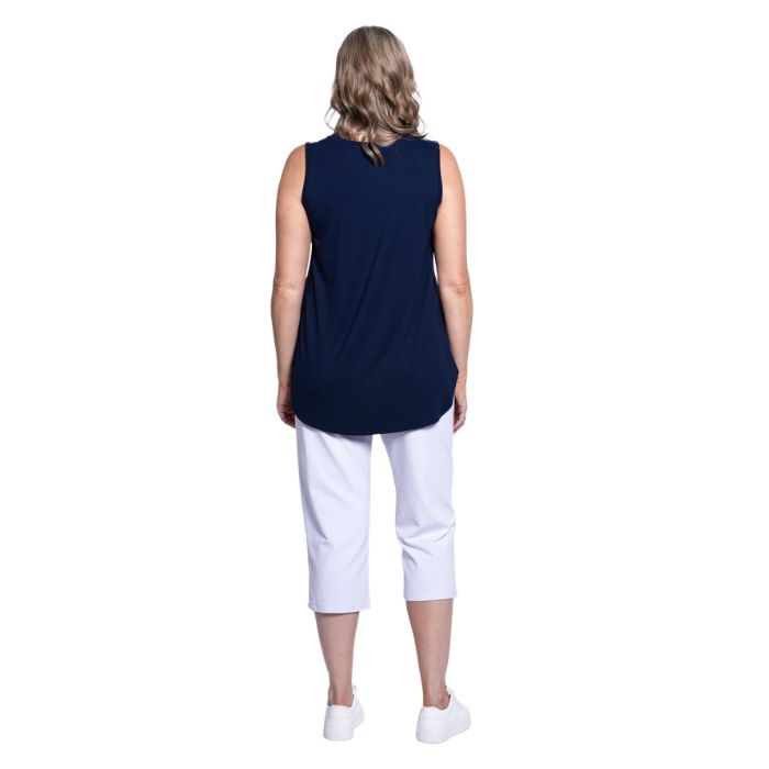 female model wearing white susan capri pants and indigo blue jazz tank top  back view on white background