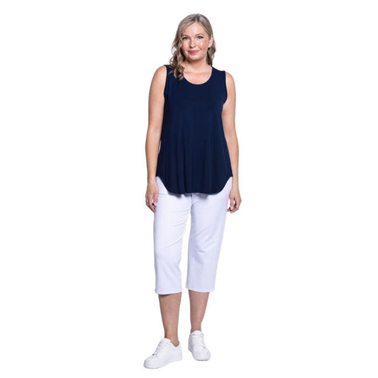 female model wearing white susan capri pants and indigo blue jazz tank top  front view on white background