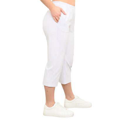 female model wearing white susan capri pants side view on white background