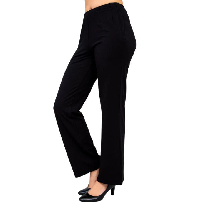 female model wearing black susan pants side view on white background