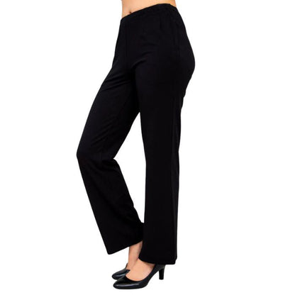 female model wearing black susan pants side view on white background