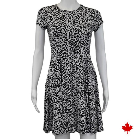 mannequin wearing leopard print swing dress front view on white background
